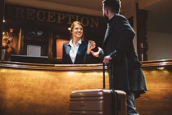 A guest picking up a key at the hotel reception